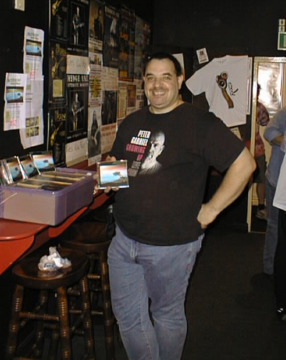 Guy proudly displays his wares 